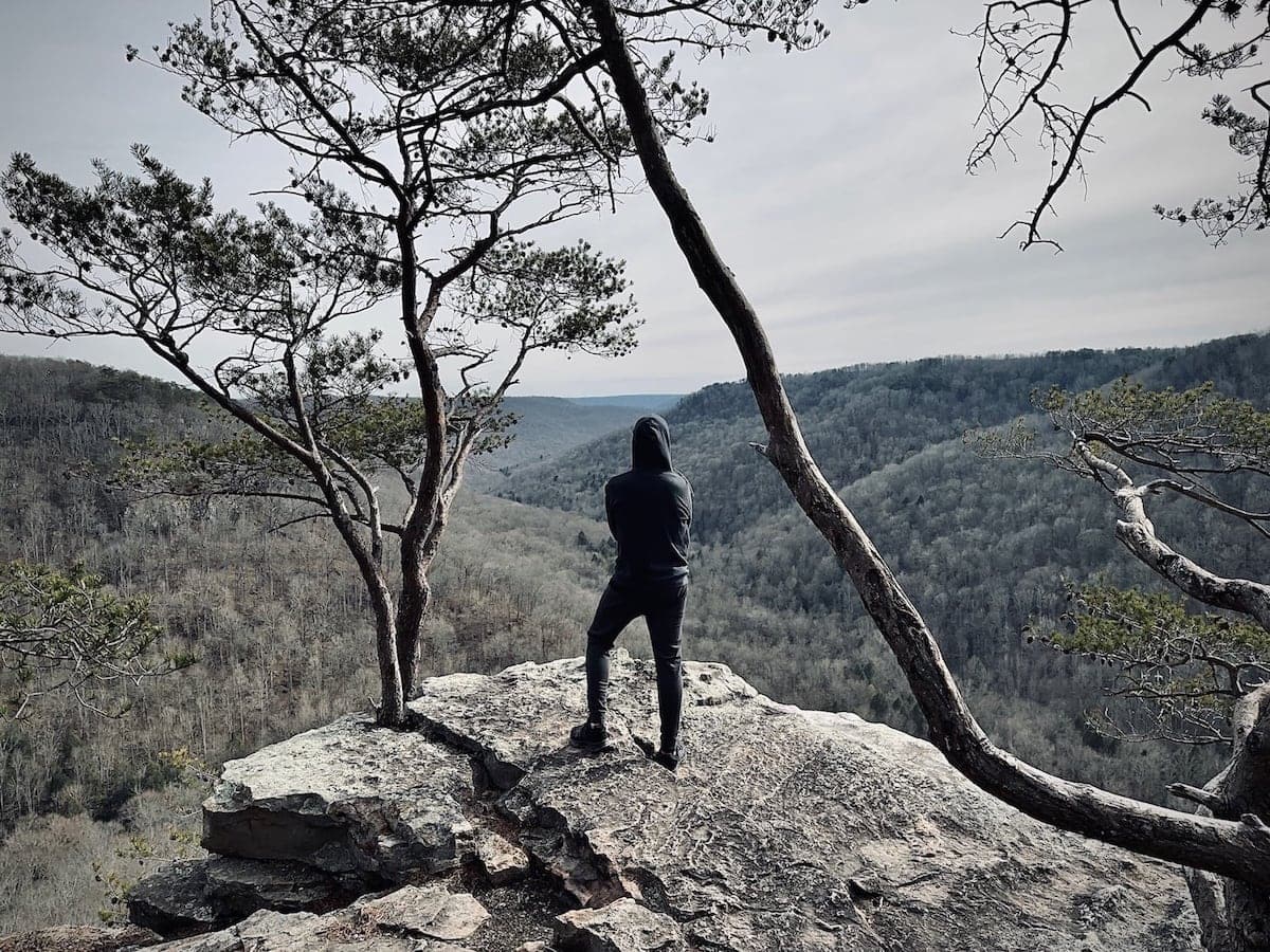 Someone standing near the edge of an overlook